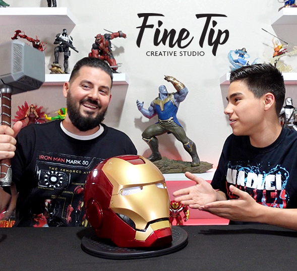 Father and son with Iron Man helmet in foreground and other collectibles in background. banner image